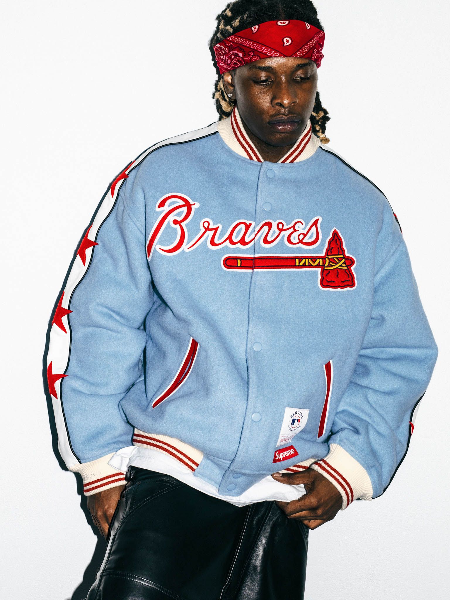 Supreme x Mitchell & Ness Atlanta Braves Wool Varsity Jacket in light blue, front on model
