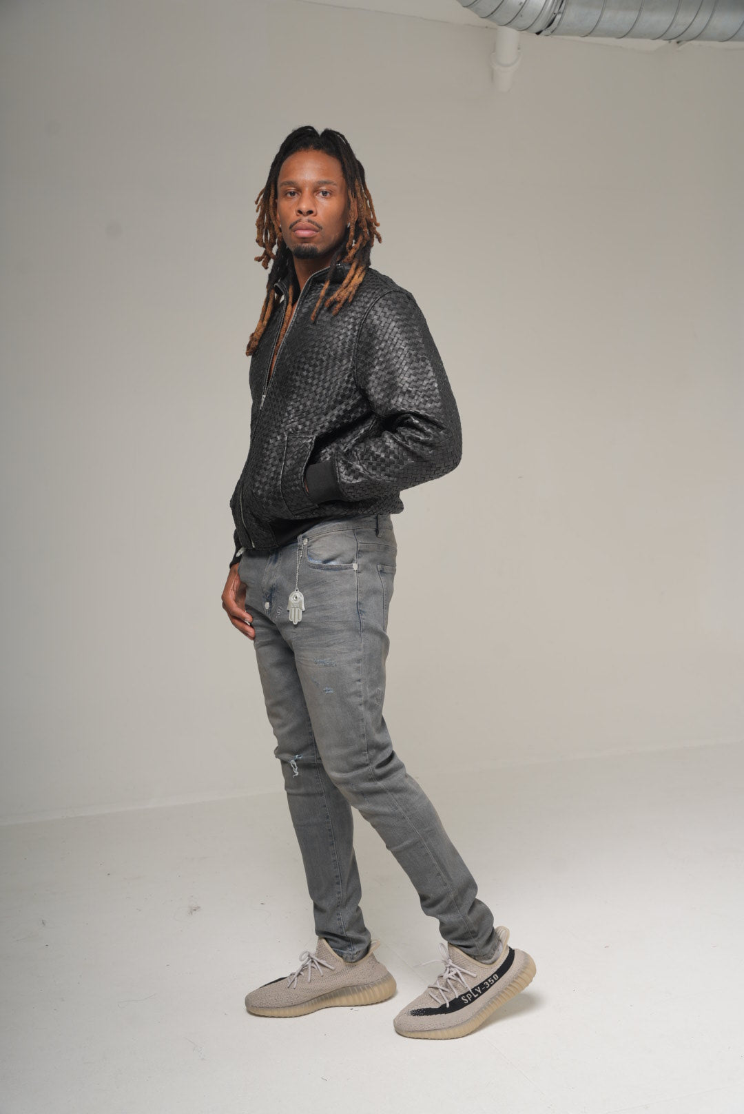KASH Hamsa-24 skinny denim in deep grey on model, three-quarter view