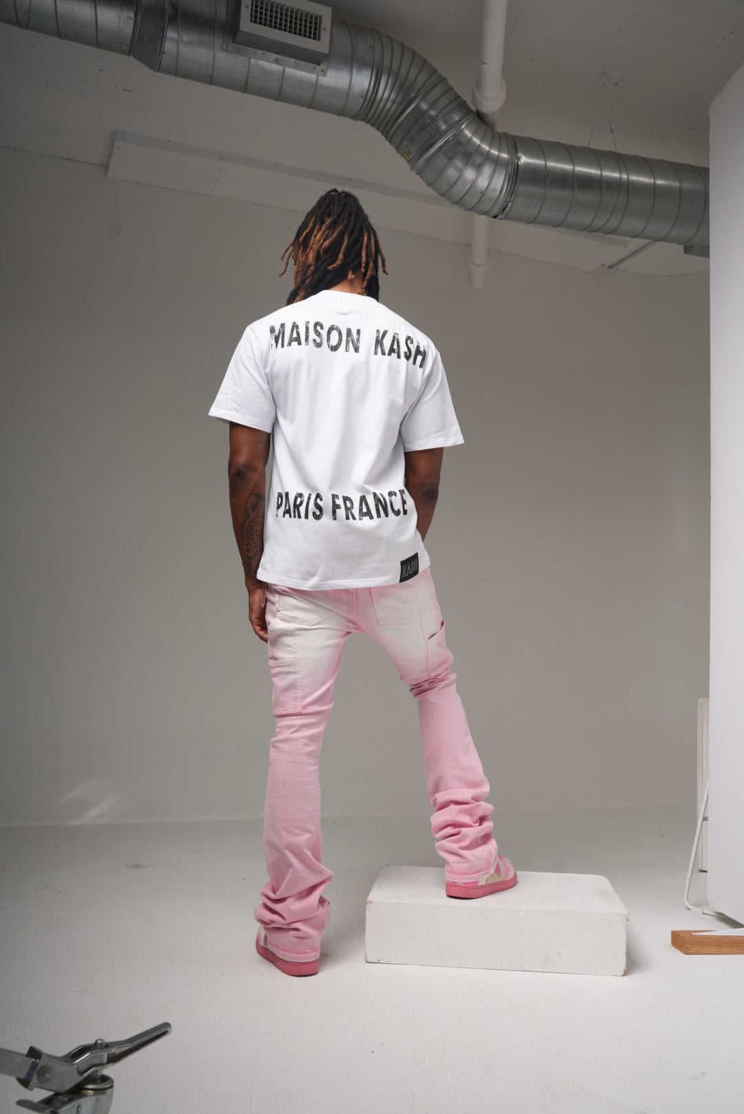 Maison Kash logo tee in white on model, back view