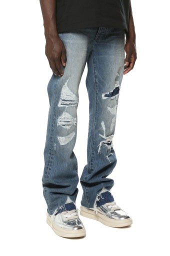 Purple Brand Vintage Heavy Destroy jeans in light indigo, side on model