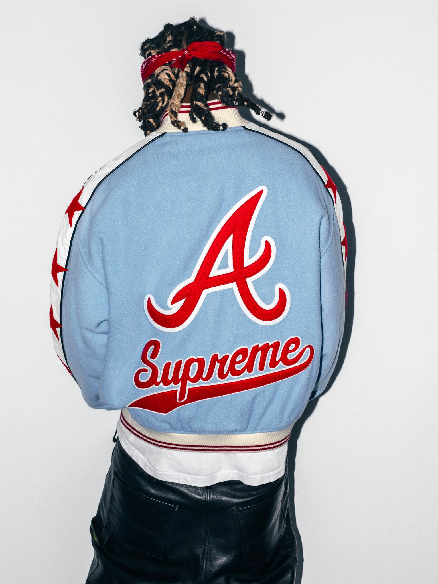 Supreme x Mitchell & Ness Atlanta Braves Wool Varsity Jacket in light blue, back on model