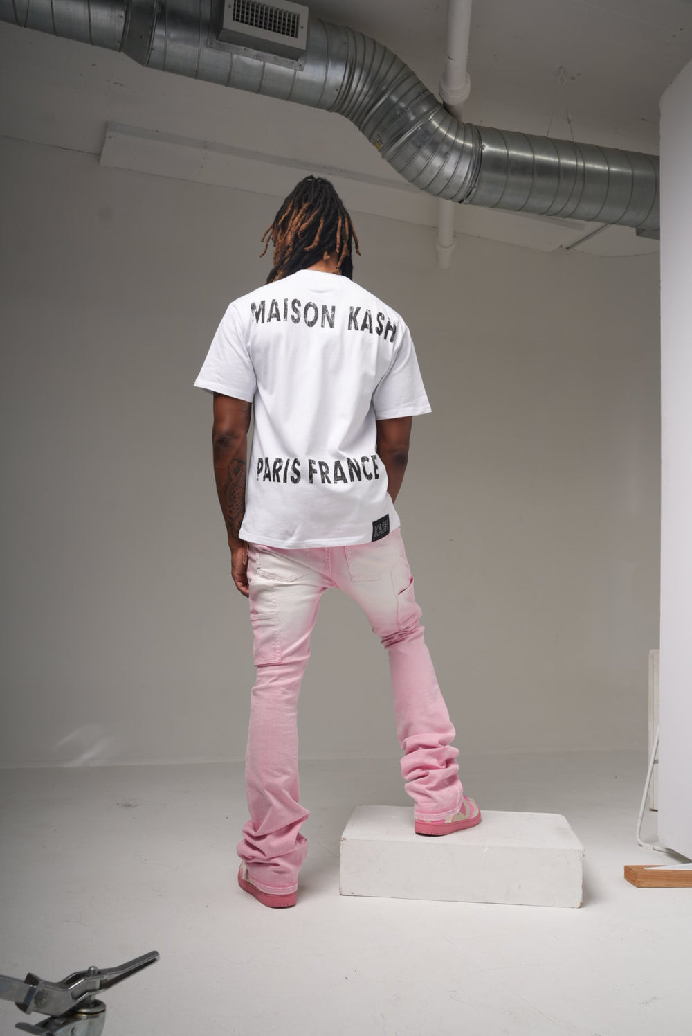 Maison Kash logo tee in white on model, back view